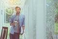 Caucasian architect man mini break and hand holding a glasses of coffee at modern office,Happy and smiling Royalty Free Stock Photo