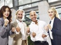 Multiethnic corporate executives showing determination and team Royalty Free Stock Photo