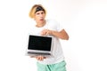 Caucasian attractive blond guy showing a laptop screen with a banner with a layout on a white background
