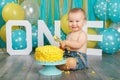 Caucasian baby boy celebrating his first birthday. Cake smash Royalty Free Stock Photo