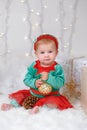 Caucasian Baby Girl With Blue Eyes In Elf Costume Celebrating Christmas Or New Year Holiday