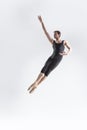 Caucasian Ballet Dancer Young Caucasian Athletic Man in Black Suit Posing Flying Dancing in Studio On White Royalty Free Stock Photo