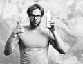 Caucasian bearded macho man holding bottle of milk Royalty Free Stock Photo