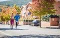 Beardy male and brunette female jogging together