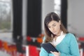 Caucasian beautiful female student reading on a table portrait