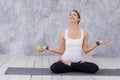 Caucasian beautiful healthy athletic sportive girl eat green apple after the training and looking at camera Royalty Free Stock Photo