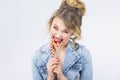 Caucasian Blond Girl Eating Big Red-Yellow Candy Cane Royalty Free Stock Photo