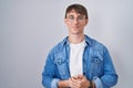 Caucasian blond man standing wearing glasses with hands together and crossed fingers smiling relaxed and cheerful Royalty Free Stock Photo