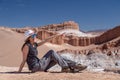 Casual woman enjoy solo trip and admire unique epic landscape of the Moon Valley, Chile