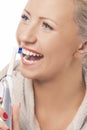 Caucasian Blond Woman Face Closeup Cleaning Teeth with Electric Royalty Free Stock Photo