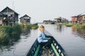 Caucasian blonde woman having a boat ride on Inle lake, Myanmar Royalty Free Stock Photo