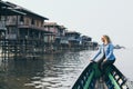 Caucasian blonde woman having a boat ride on Inle lake, Myanmar Royalty Free Stock Photo