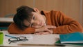Caucasian bored schoolboy sleepy at school elementary education study learning tired exhausted sad upset fatigued child Royalty Free Stock Photo
