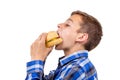 Caucasian boy eating burger and hamburger on white background, beef meal