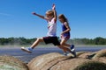 Boy and girl jumping and running on haystacks