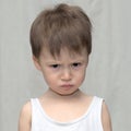 Caucasian boy in a gloomy mood Royalty Free Stock Photo