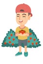 Caucasian boy holding fresh strawberries in hands. Royalty Free Stock Photo