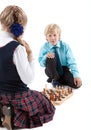 Caucasian boy looking at camera while playing game with girl, isolated white background Royalty Free Stock Photo