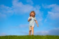 Caucasian boy in a park running and smiling. Happy kid laughing. Emotion face joy child. Joyful, funny spring, summer Royalty Free Stock Photo