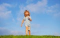 Caucasian boy in a park running and smiling. Happy kid laughing. Emotion face joy child. Joyful, funny spring, summer Royalty Free Stock Photo