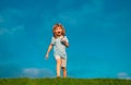 Caucasian boy in a park running and smiling. Happy kid laughing. Emotion face joy child. Joyful, funny spring, summer Royalty Free Stock Photo