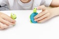 A caucasian boy playing different roles by using finger puppets, toys for expressing his emotions, agression, fear and freandship Royalty Free Stock Photo