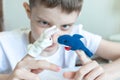 A caucasian boy playing different roles by using finger puppets, toys for expressing his emotions, agression, fear and freandship Royalty Free Stock Photo