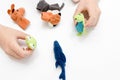 A caucasian boy playing finger puppets, toys, dolls - figures of animals, heroes of the puppet theatre put on fingers of human Royalty Free Stock Photo