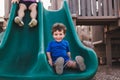 Caucasian boy playing on a slide in Mackey park in Florida Royalty Free Stock Photo