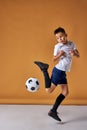 Caucasian boy playing soccer, happy child, young male teenager enjoying sports game Royalty Free Stock Photo