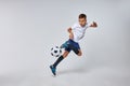 caucasian boy playing soccer, happy child, young male teenager enjoying sports game Royalty Free Stock Photo