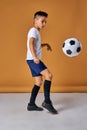 caucasian boy playing soccer, happy child, young male teenager enjoying sports game Royalty Free Stock Photo