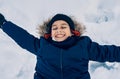 Caucasian boy smiling lying in snow