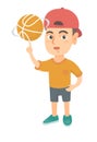 Caucasian boy spinning basketball ball on finger.