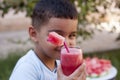 Caucasian boy with watermelon juice Royalty Free Stock Photo