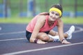 Caucasian Brunette Female in Athletic Sportgear Having Legs Stretching Excercises Outdoors Royalty Free Stock Photo