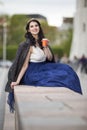 Caucasian Brunette Woman Drinking Tea or Coffee In The City Center Outdoors Royalty Free Stock Photo
