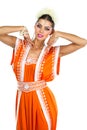 Caucasian brunette woman in orange indian national dress sari Royalty Free Stock Photo