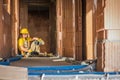 Caucasian Builder Worker Resting on the Floor Royalty Free Stock Photo
