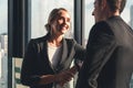 Caucasian business couple having business conversation together in office Royalty Free Stock Photo