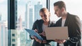 Caucasian business couple having business conversation together in office Royalty Free Stock Photo