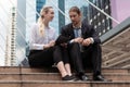 Caucasian business couple sitting together and having business discussion outdoor Royalty Free Stock Photo