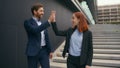 Caucasian business male female two people walking in city outdoors discuss colleagues coworkers businessman Royalty Free Stock Photo