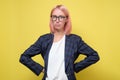 Caucasian business woman with glasses listening to you seriously holding hands on hips. Royalty Free Stock Photo