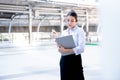 Caucasian business woman or secretary, Standing, looking and holding the report, Royalty Free Stock Photo