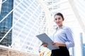 Caucasian business woman or secretary, Standing, looking and holding the report Royalty Free Stock Photo