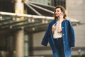 Caucasian business woman speaking by phone. Waist up portrait of a successful European business woman woman, talking on the phone Royalty Free Stock Photo