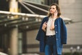 Caucasian business woman speaking by phone. Waist up portrait of a successful European business woman woman, talking on the phone Royalty Free Stock Photo