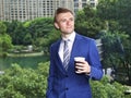 Caucasian businessman with coffee thinking