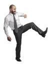 Caucasian businessman in kicking position